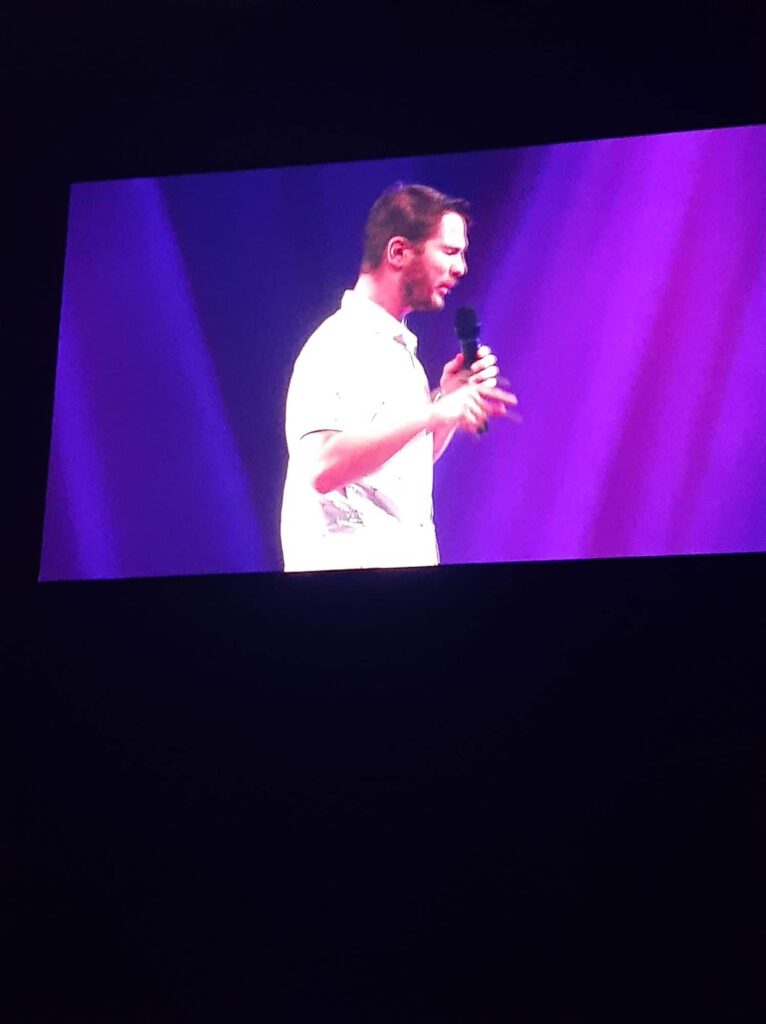 Chris Ulery speaking to a youth and young adult crowd