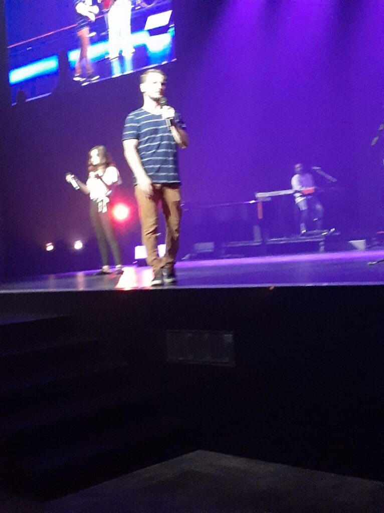 Chris Ulery speaking to a youth and young adult crowd