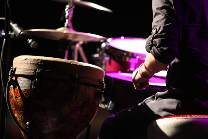 Close-up of Chris Ulery playing hand drums
