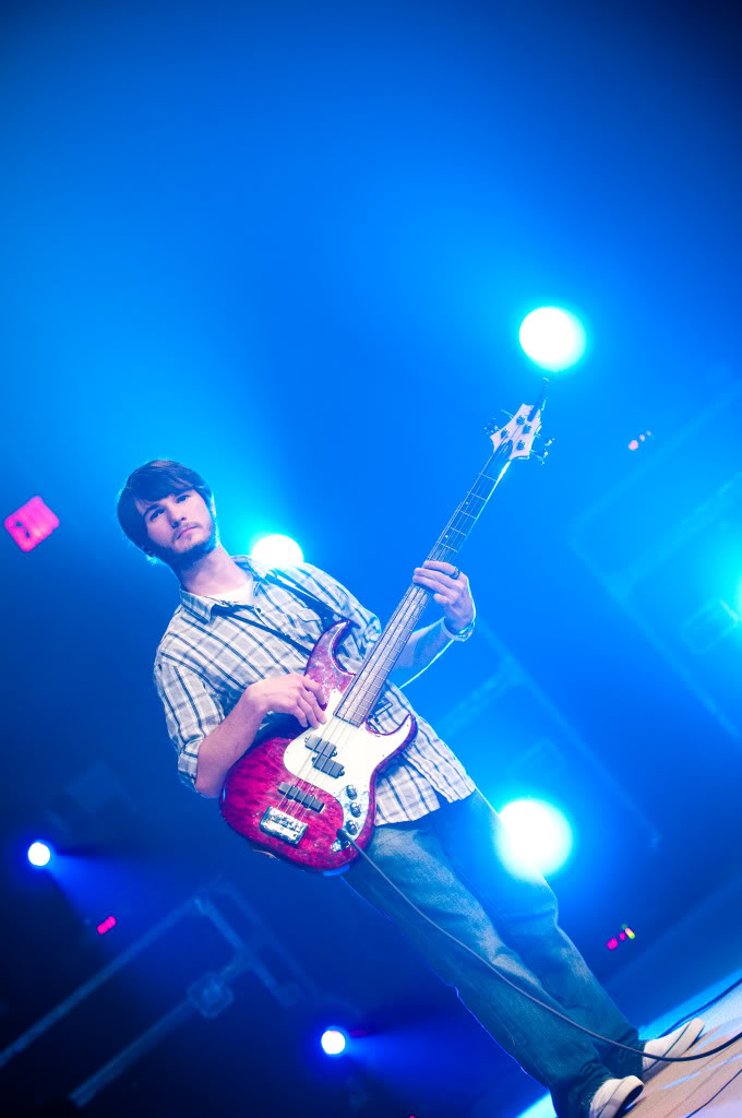 Chris Ulery on bass under blue stage lights