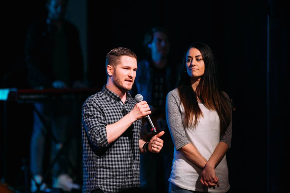 Chris and Jessica Ulery speaking together on stage