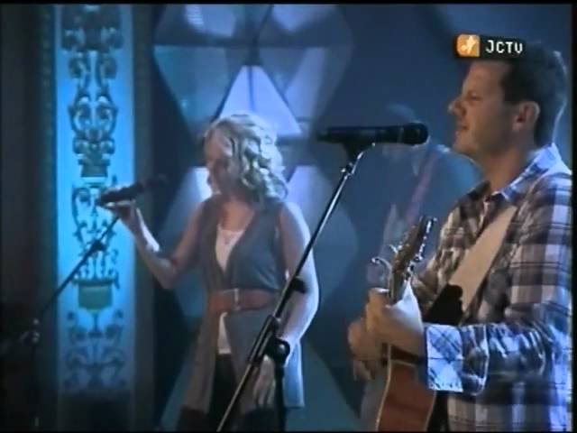 Chris Ulery playing acoustic guitar while performing Move or Move Me