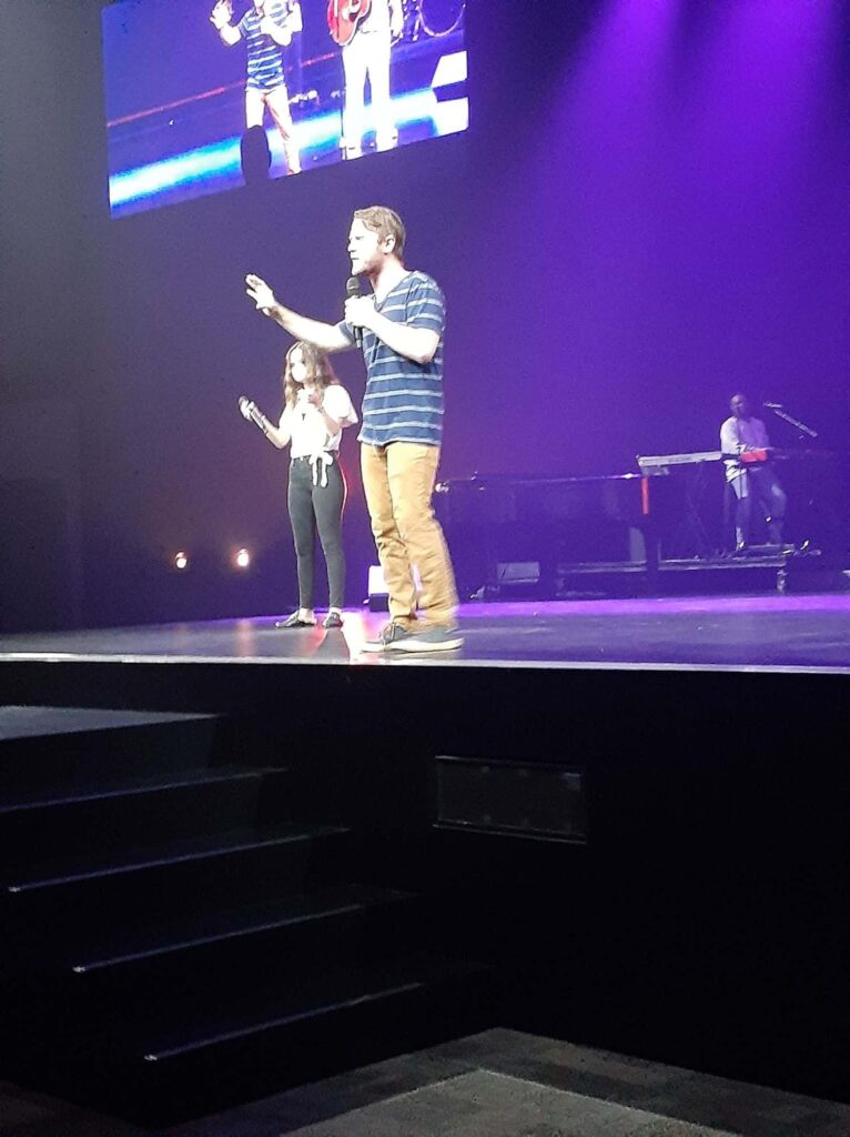 Chris Ulery ministering on the Next Gen stage at Victory Church in Tulsa