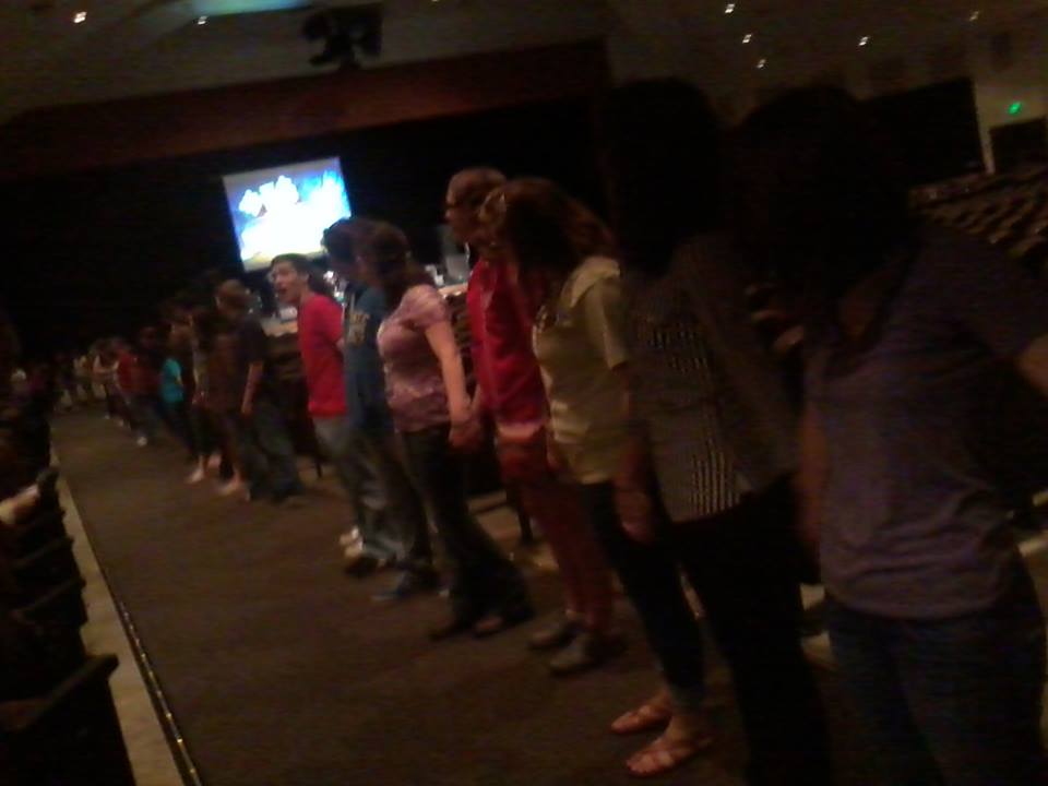 People lined up at the altar for prayer at a Chris Ulery speaking event