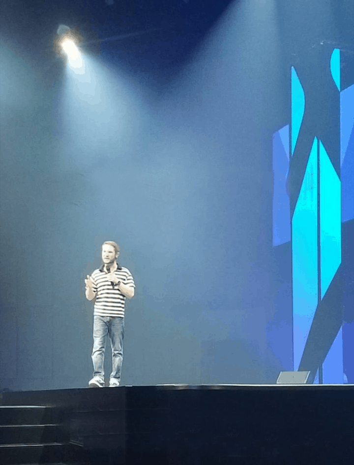 Chris Ulery preaching on the main stage at Victory Church in Tulsa