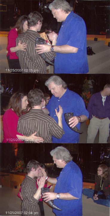 Sequence of a minister praying over a young man at a Chris Ulery event