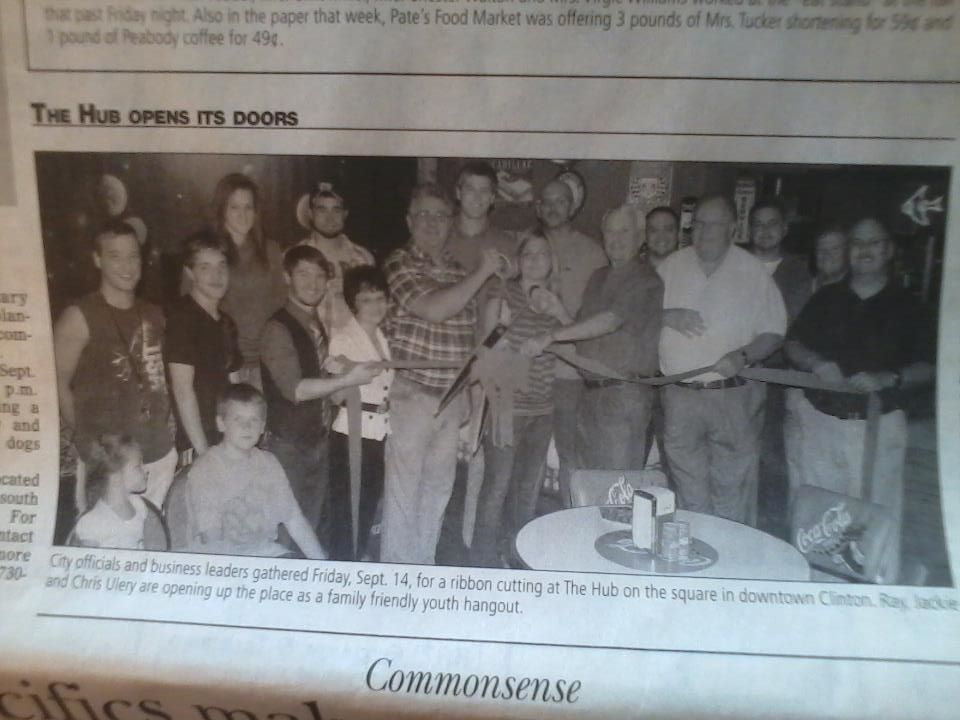 Newspaper clipping of Chris Ulery with Ray and Jackie Ulery at the ribbon cutting for The Hub, a family-friendly youth hangout in downtown Clinton
