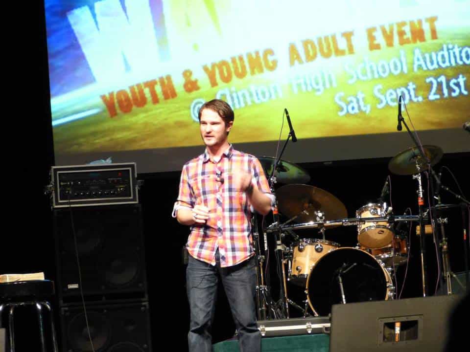 Chris Ulery speaking at a youth and young adult event at Clinton High School