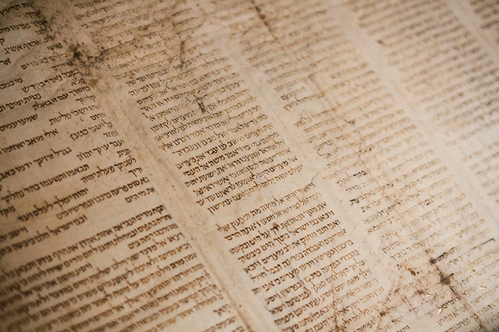 Ancient Hebrew text on a weathered parchment manuscript